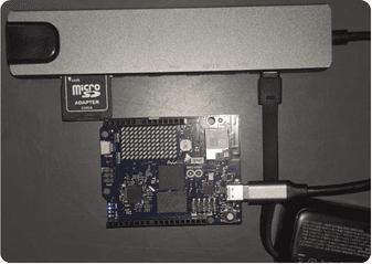 Arduino Uno Q board used as the local decision unit, connected to a USB hub